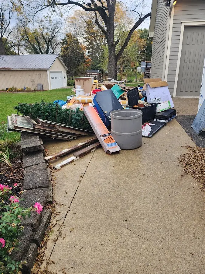 Dumpster being loaded with debris for Commercial Dumpster Rental in Valparaiso